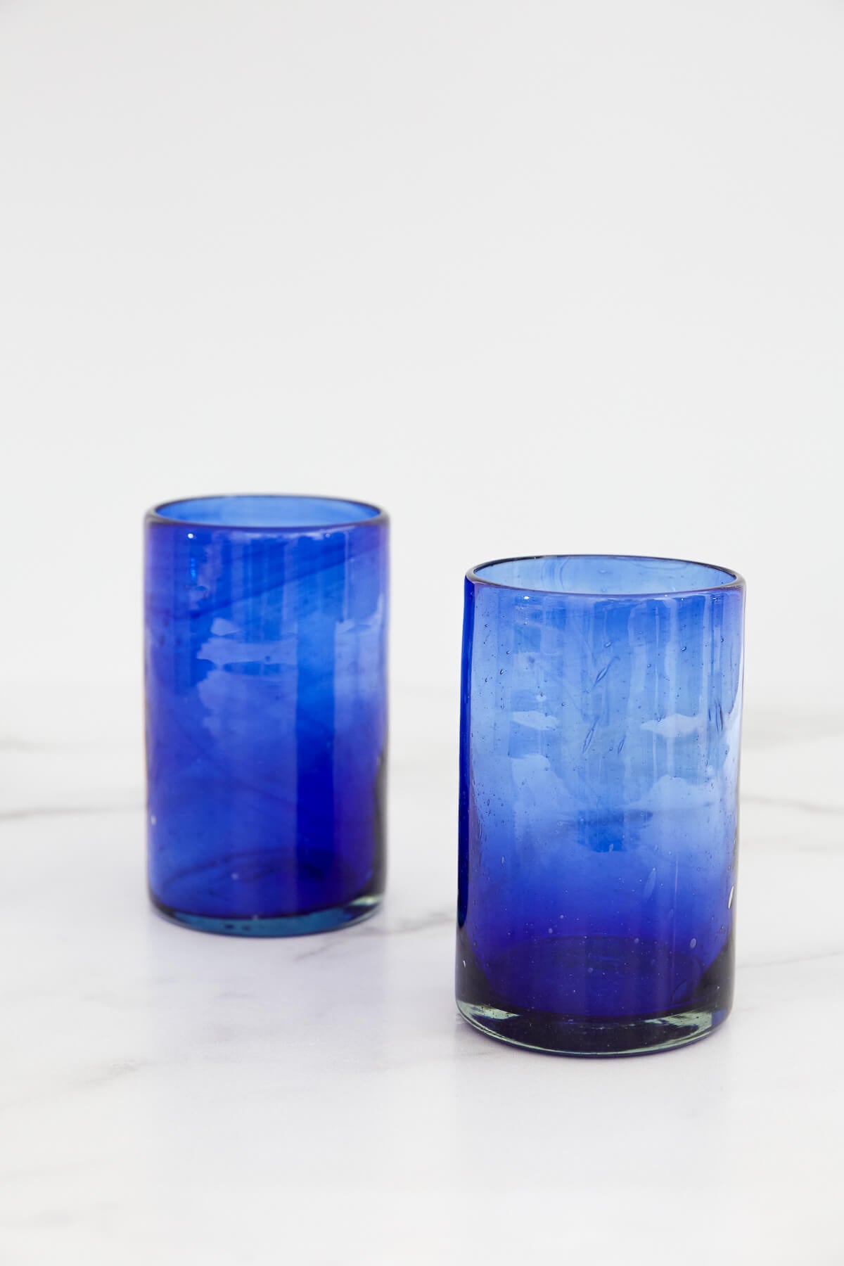 https://www.palmandperkins.com/cdn/shop/products/Copavic_LargeDrinkingGlass_Blue_2_1200x.jpg?v=1642629260