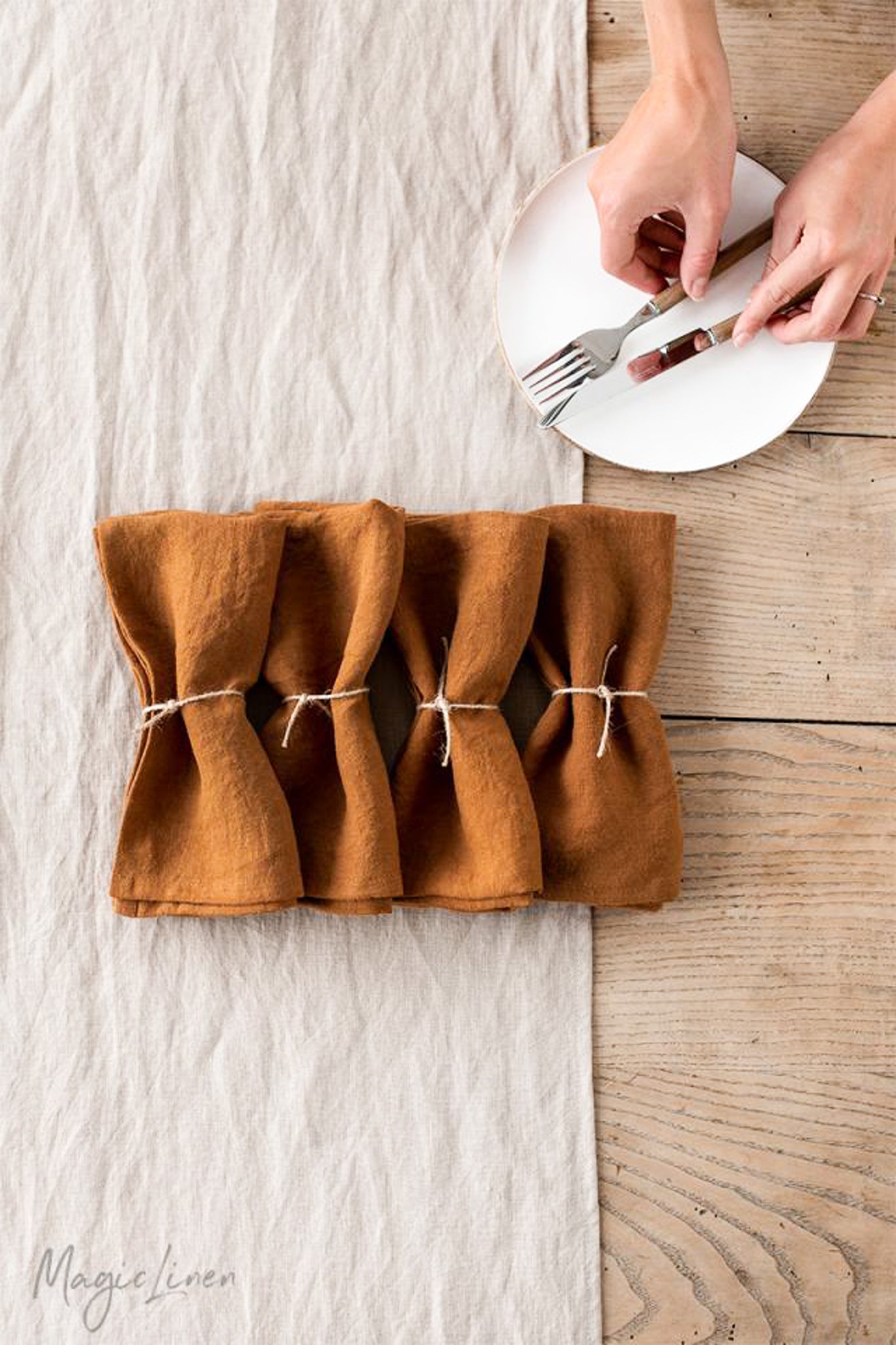 https://www.palmandperkins.com/cdn/shop/products/MagicLinen_LinenNapkinSetof2_Cinnamon_3_2048x.jpg?v=1667831362